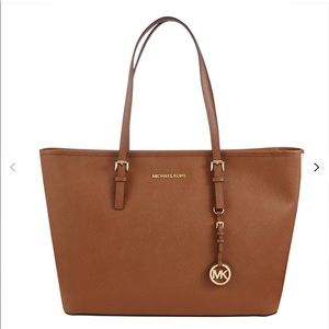 Micheal Kors bag a Jet Set Travel Tote.